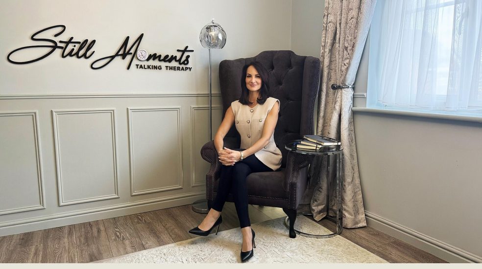 Still Moments Talking Therapy website homepage showing therapist seated in a calm consultation setting.